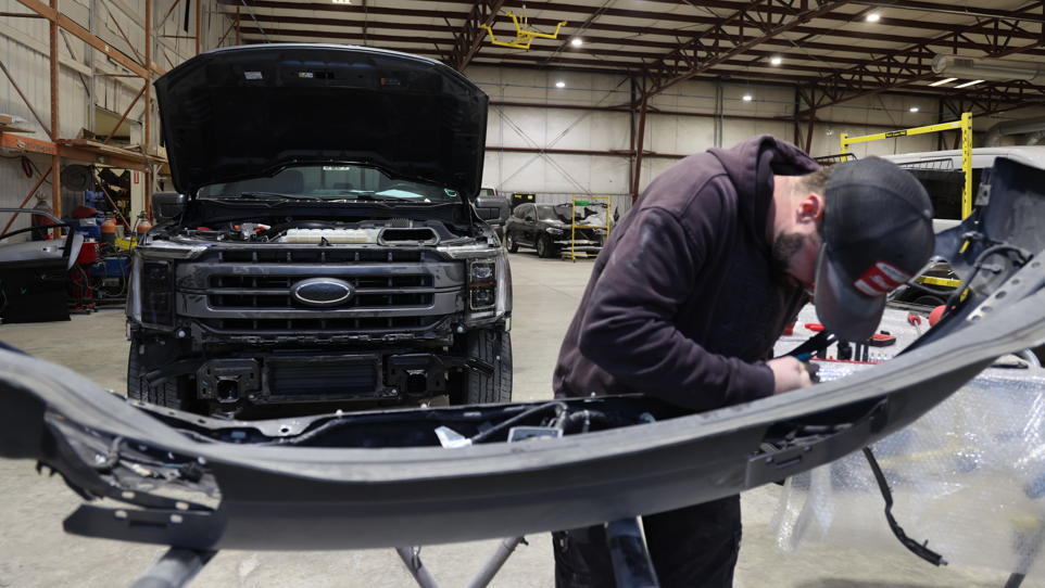 Technician performing truck collision repair at Burnside Express Collision in Zionsville Indiana, serving fleet and personal vehicle owners across Whitestown, Carmel, and northwest Indianapolis