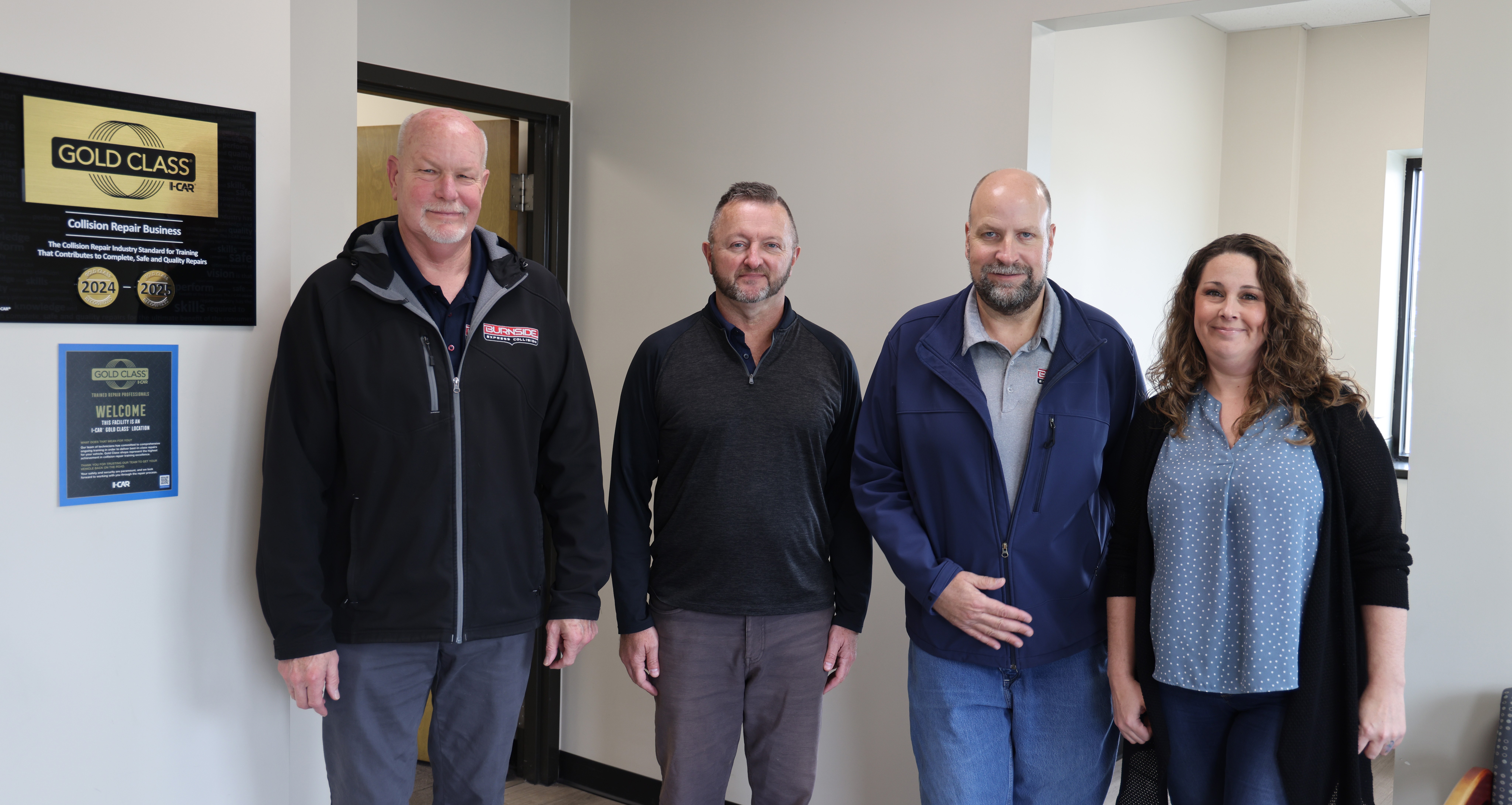 Burnside Express Collision Zionsville staff standing inside the collision repair shop near the customer service area, serving drivers across Zionsville, Whitestown, and Northwest Indianapolis.
